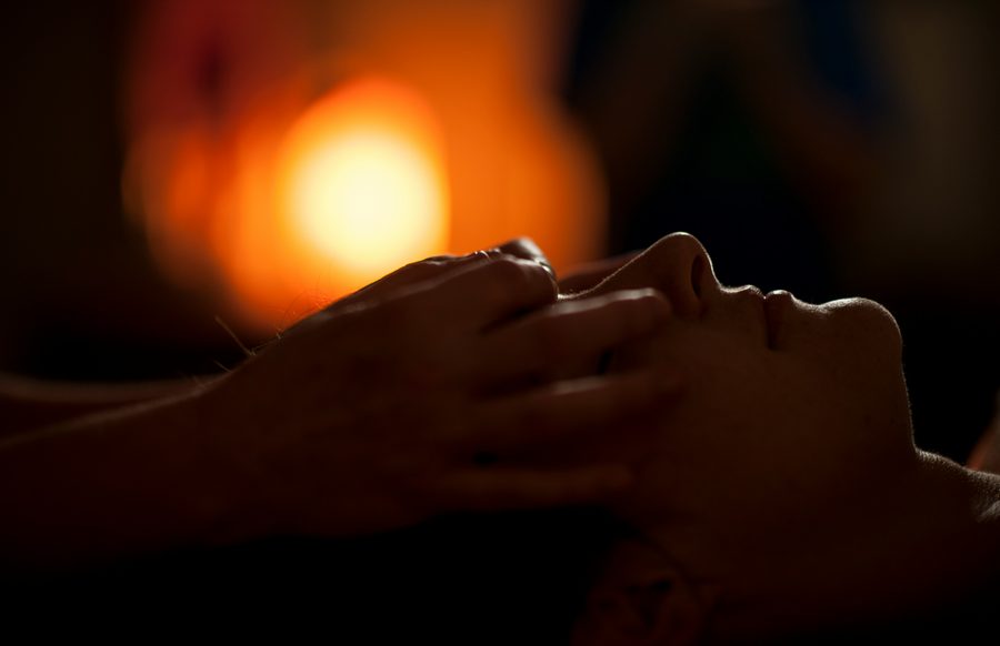 Candles, towels and calming spa ambience